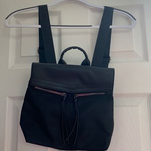 Botkier black backpack purse with front zippered pockets. Brand new with tags.